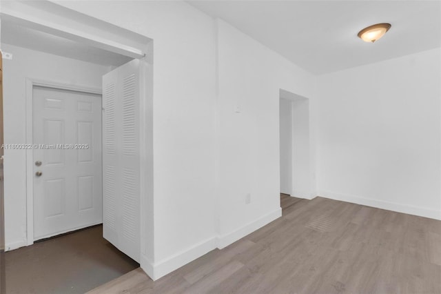 3051 NW 77th St, Miami, FL 33147 - empty room featuring wood finished floors and baseboards
