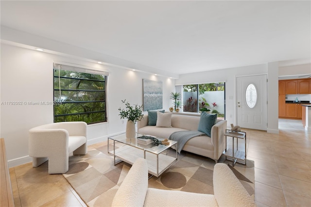 4730 SW 67th Ave Unit I1, Miami, FL 33155 - living room featuring light tile patterned flooring and baseboards