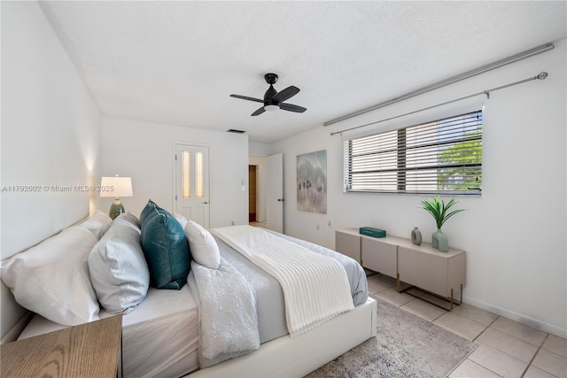 4730 SW 67th Ave Unit I1, Miami, FL 33155 - bedroom with light tile patterned flooring, a ceiling fan, and baseboards
