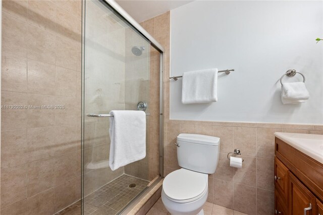 4730 SW 67th Ave Unit I1, Miami, FL 33155 - full bathroom featuring toilet, a shower stall, vanity, tile walls, and a wainscoted wall