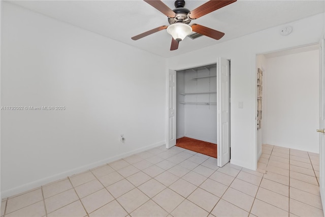 4730 SW 67th Ave Unit I1, Miami, FL 33155 - unfurnished bedroom with a closet, a ceiling fan, light tile patterned flooring, and baseboards