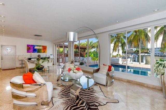 418 Tammarind Dr, Hallandale Beach, FL 33009 - living area with light tile patterned floors and baseboards