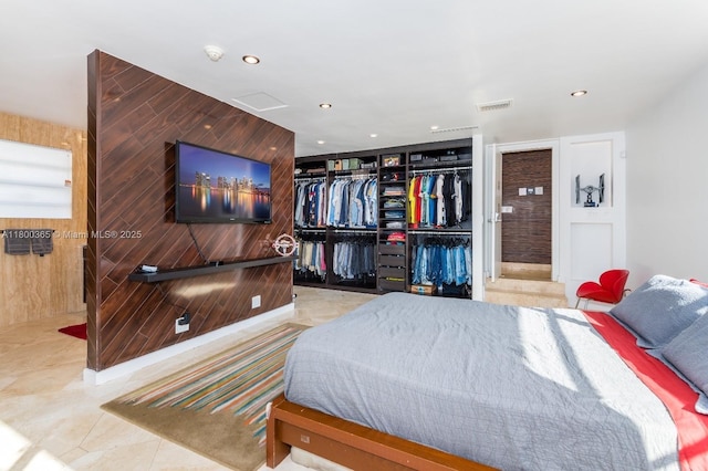 418 Tammarind Dr, Hallandale Beach, FL 33009 - bedroom with a closet, recessed lighting, and wooden walls