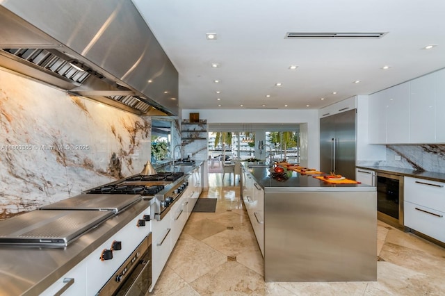 418 Tammarind Dr, Hallandale Beach, FL 33009 - kitchen featuring stainless steel appliances, modern cabinets, exhaust hood, wine cooler, and recessed lighting