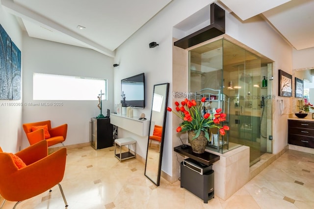 418 Tammarind Dr, Hallandale Beach, FL 33009 - sitting room featuring lofted ceiling, baseboards, and tile patterned flooring
