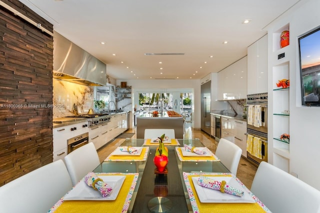 418 Tammarind Dr, Hallandale Beach, FL 33009 - dining area featuring wine cooler, recessed lighting, and built in shelves