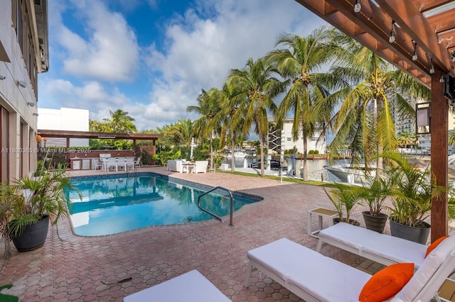 418 Tammarind Dr, Hallandale Beach, FL 33009 - community pool featuring a patio and exterior bar