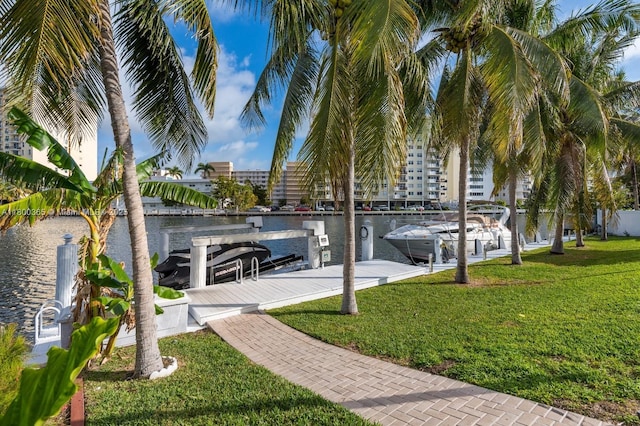 418 Tammarind Dr, Hallandale Beach, FL 33009 - view of community with a lawn, a boat dock, and a water view