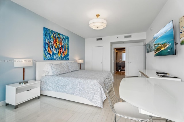 6799 Collins Ave Unit 1602, Miami Beach, FL 33141 - bedroom with wood finished floors