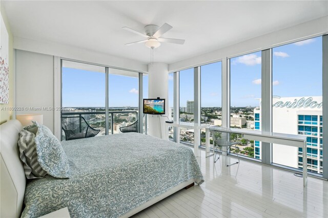 6799 Collins Ave Unit 1602, Miami Beach, FL 33141 - bedroom with ceiling fan and wood finished floors