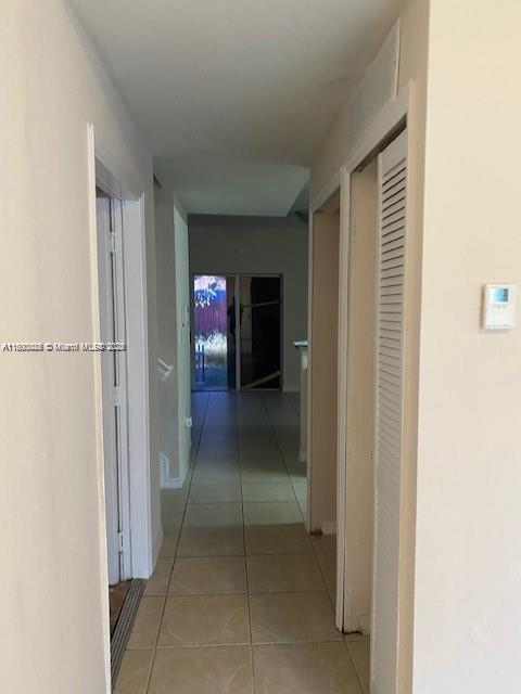 646 SW 7th Ter, Florida City, FL 33034 - hall featuring light tile patterned flooring