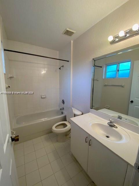 646 SW 7th Ter, Florida City, FL 33034 - full bathroom featuring tile patterned floors, toilet, shower / bath combination, and vanity