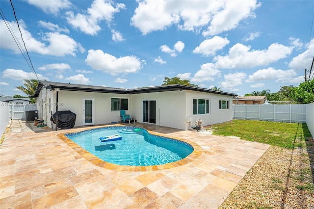7450 Branch St, Hollywood, FL 33024 - rear view of house with stucco siding, a patio area, and central air condition unit