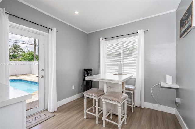 7450 Branch St, Hollywood, FL 33024 - dining area with light wood-type flooring, crown molding, baseboards, and recessed lighting