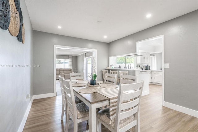 7450 Branch St, Hollywood, FL 33024 - dining space with baseboards, light wood finished floors, and recessed lighting