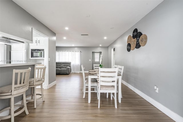 7450 Branch St, Hollywood, FL 33024 - dining room with wood finished floors, baseboards, and recessed lighting