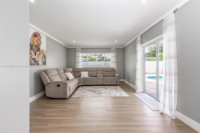 7450 Branch St, Hollywood, FL 33024 - living room with baseboards, crown molding, light wood-style floors, and recessed lighting