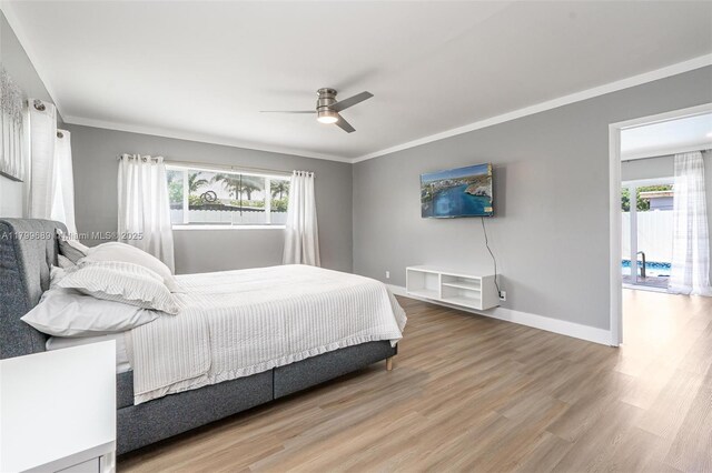 7450 Branch St, Hollywood, FL 33024 - bedroom with wood finished floors, a ceiling fan, baseboards, and ornamental molding