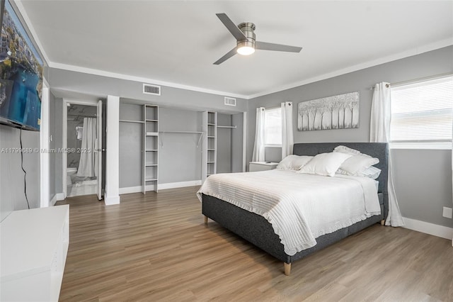 7450 Branch St, Hollywood, FL 33024 - bedroom with baseboards, multiple windows, wood finished floors, and ornamental molding