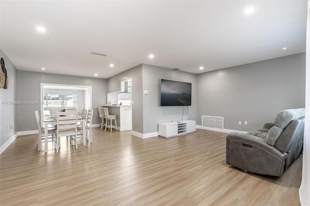 7450 Branch St, Hollywood, FL 33024 - living area featuring baseboards, light wood finished floors, and recessed lighting
