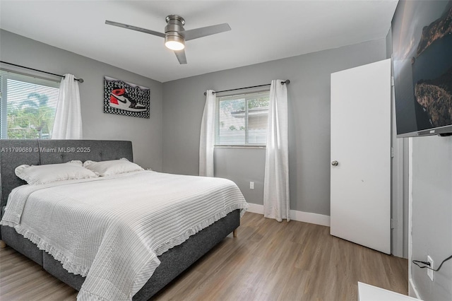 7450 Branch St, Hollywood, FL 33024 - bedroom with multiple windows, wood finished floors, ceiling fan, and baseboards