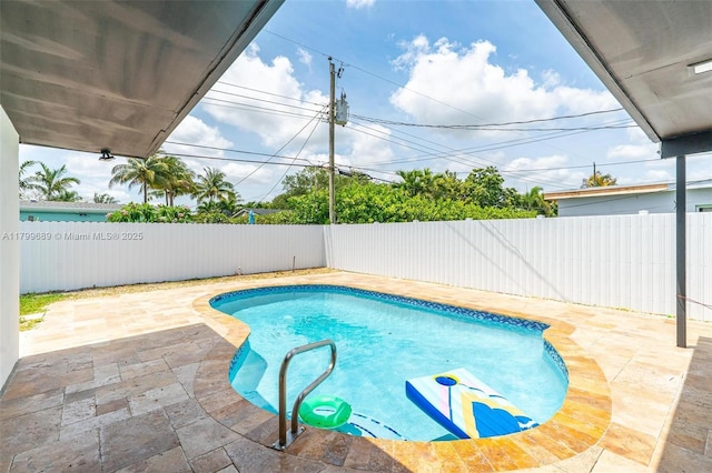7450 Branch St, Hollywood, FL 33024 - view of swimming pool featuring a fenced backyard and a patio