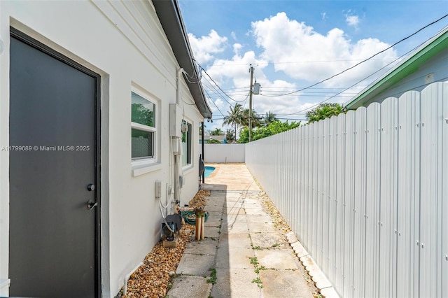 7450 Branch St, Hollywood, FL 33024 - view of home's exterior with stucco siding and a fenced backyard