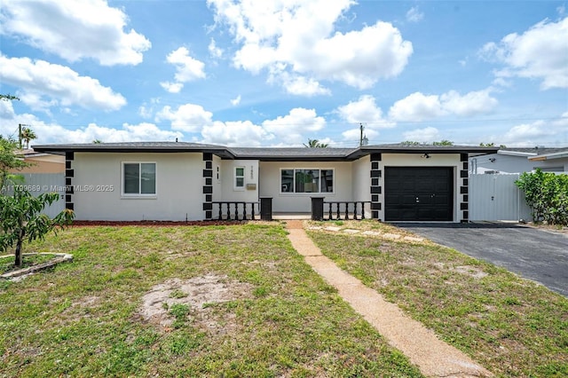 7450 Branch St, Hollywood, FL 33024 - ranch-style home featuring driveway, an attached garage, and stucco siding