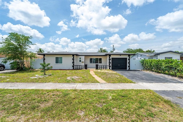 7450 Branch St, Hollywood, FL 33024 - single story home with driveway, a garage, and stucco siding