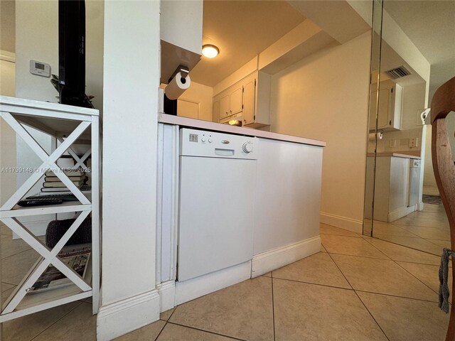 kitchen view of dishwasher and baseboards
