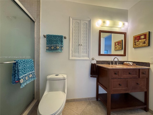 bathroom featuring a stall shower, tile patterned floors, toilet, and vanity