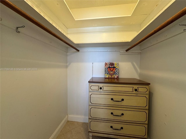 spacious closet featuring light tile patterned floors