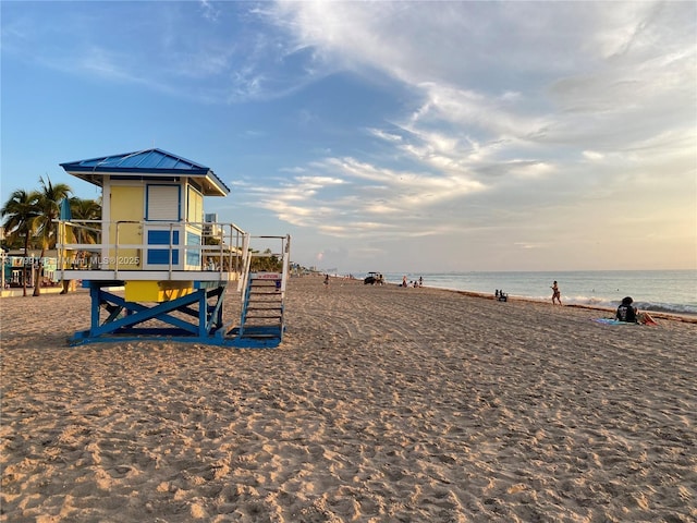 view of play area featuring view of water and beach