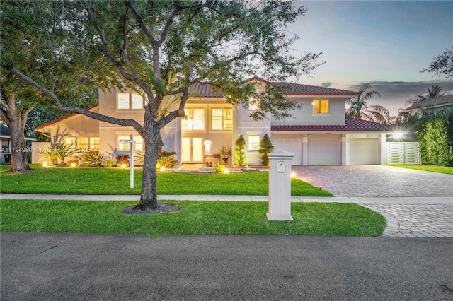 20230 NW 7th St, Pembroke Pines, FL 33029 - view of front of property featuring decorative driveway, a front lawn, an attached garage, and stucco siding