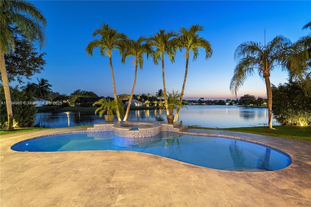 20230 NW 7th St, Pembroke Pines, FL 33029 - pool at dusk with a water view, a patio area, and a pool with connected hot tub
