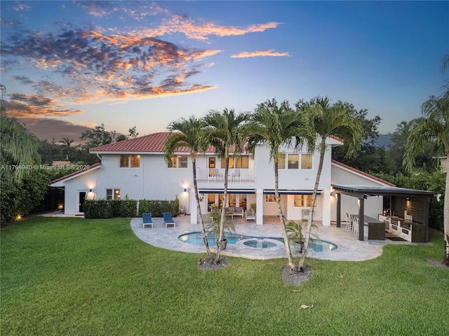 20230 NW 7th St, Pembroke Pines, FL 33029 - rear view of property featuring an in-ground hot tub, a patio area, a balcony, a yard, and an outdoor pool