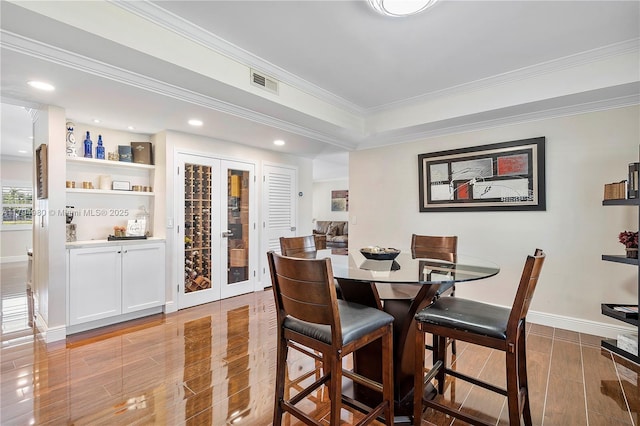 20230 NW 7th St, Pembroke Pines, FL 33029 - dining area with light wood-style flooring, crown molding, french doors, and recessed lighting