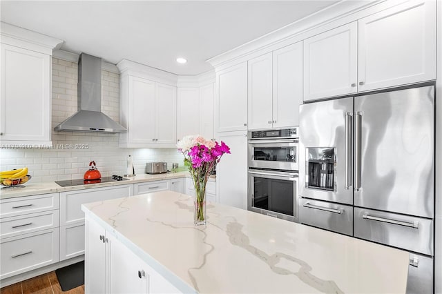 20230 NW 7th St, Pembroke Pines, FL 33029 - kitchen with appliances with stainless steel finishes, wall chimney range hood, white cabinetry, tasteful backsplash, and recessed lighting
