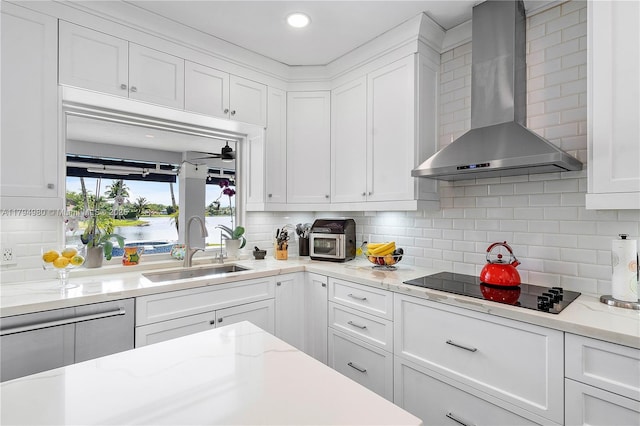 20230 NW 7th St, Pembroke Pines, FL 33029 - kitchen featuring wall chimney range hood, black electric stovetop, white cabinets, tasteful backsplash, and recessed lighting