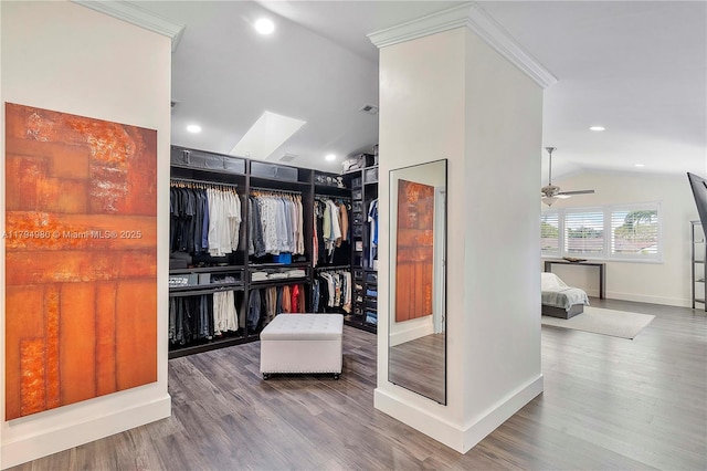 20230 NW 7th St, Pembroke Pines, FL 33029 - spacious closet featuring lofted ceiling, wood finished floors, a ceiling fan, and a skylight