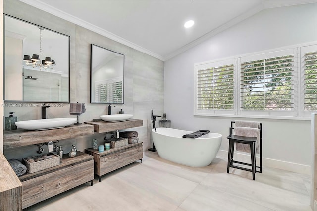 20230 NW 7th St, Pembroke Pines, FL 33029 - bathroom featuring vaulted ceiling, a soaking tub, a chandelier, double vanity, and tile patterned floors