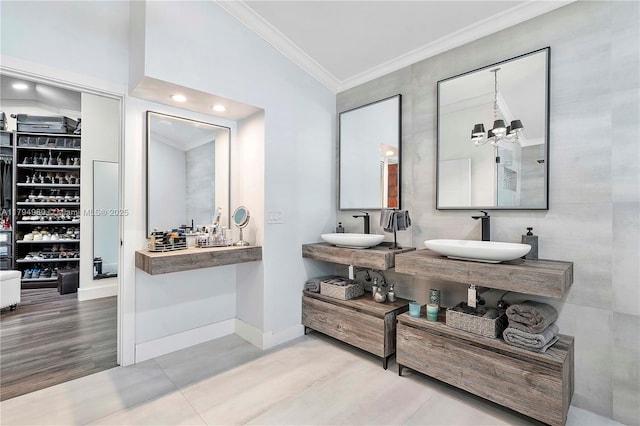 20230 NW 7th St, Pembroke Pines, FL 33029 - bathroom featuring a sink, ornamental molding, wood finished floors, a chandelier, and baseboards