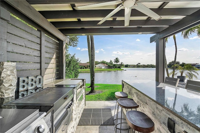 20230 NW 7th St, Pembroke Pines, FL 33029 - view of patio / terrace featuring a water view, a ceiling fan, exterior bar, and exterior kitchen