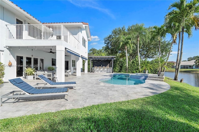 20230 NW 7th St, Pembroke Pines, FL 33029 - view of pool with a ceiling fan, a patio area, a yard, a water view, and a pool with connected hot tub