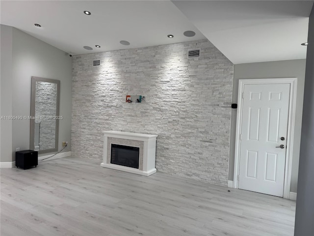 14530 SW 123rd Ct, Miami, FL 33186 - unfurnished living room featuring wood finished floors, a glass covered fireplace, and recessed lighting