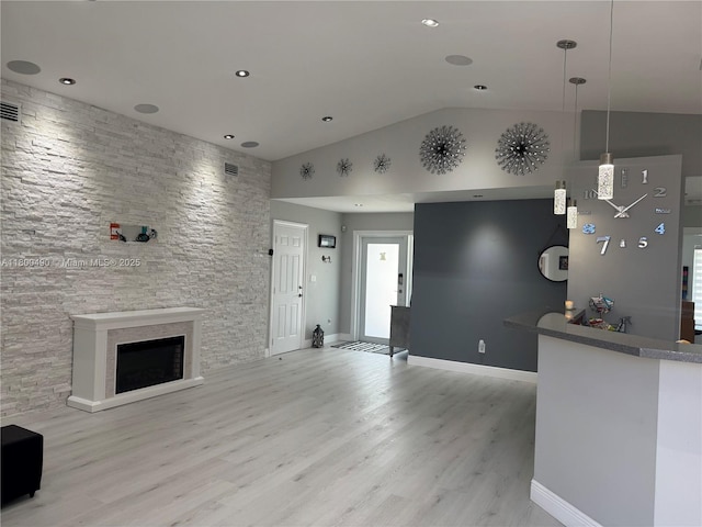14530 SW 123rd Ct, Miami, FL 33186 - unfurnished living room featuring lofted ceiling, light wood-style floors, a fireplace, and recessed lighting