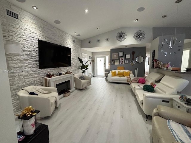 14530 SW 123rd Ct, Miami, FL 33186 - living area with wood finished floors, vaulted ceiling, a large fireplace, and recessed lighting