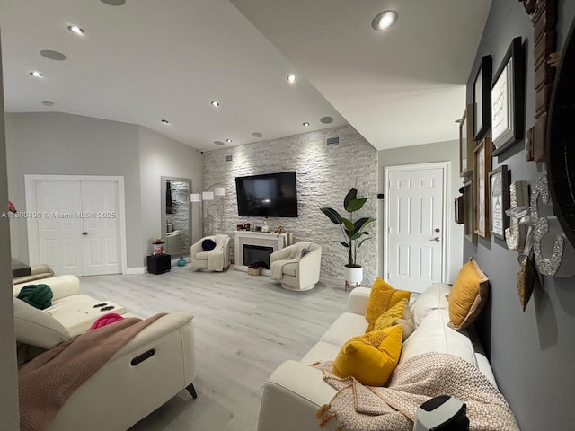 14530 SW 123rd Ct, Miami, FL 33186 - living area featuring wood finished floors, recessed lighting, a fireplace, and vaulted ceiling