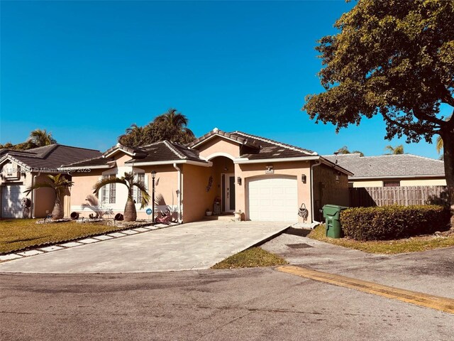 14530 SW 123rd Ct, Miami, FL 33186 - single story home with stucco siding, driveway, an attached garage, and a tiled roof
