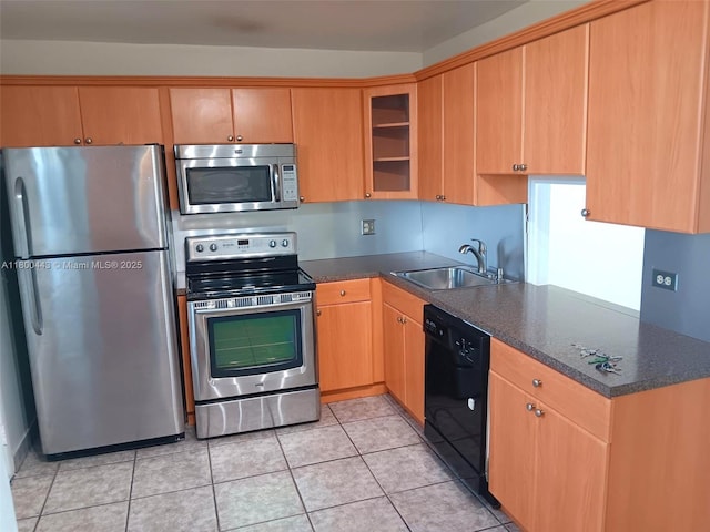 3703 NE 166th St Unit 704, North Miami Beach, FL 33160 - kitchen with appliances with stainless steel finishes, a sink, dark countertops, and glass insert cabinets